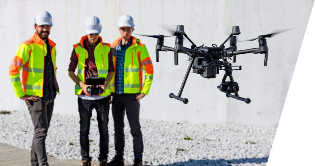 Crew members fly a drone remotely to capture images
